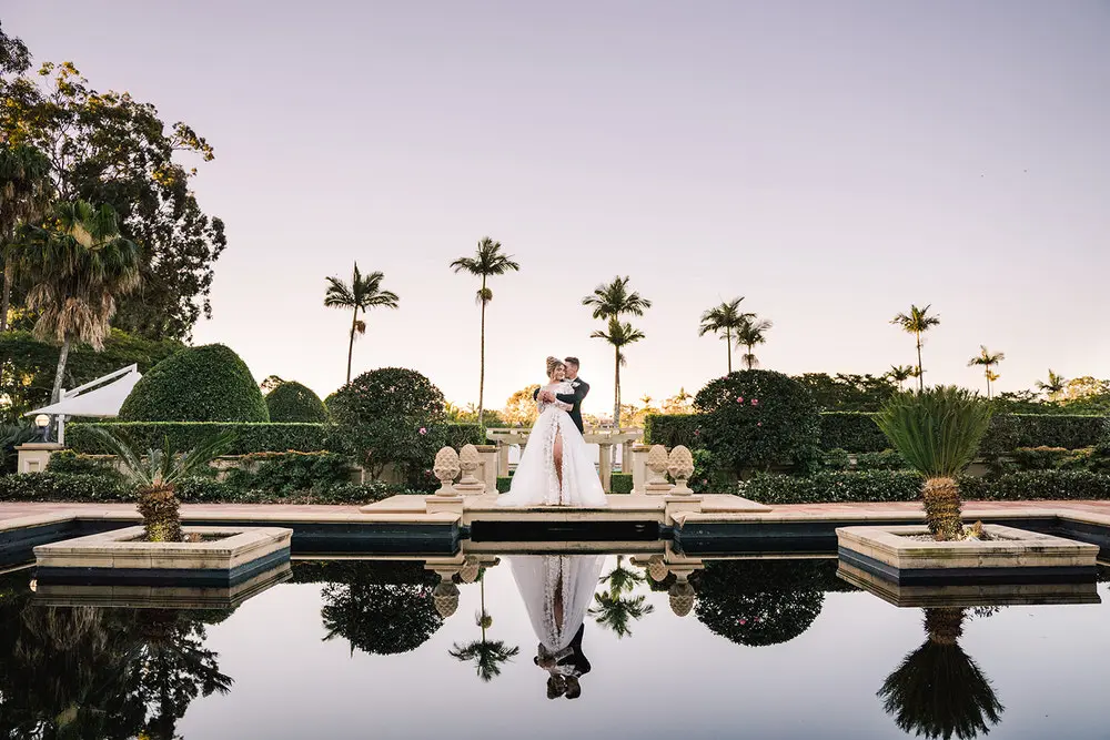 bride and groom getting married at the intercontinental resort reflection at sunset
