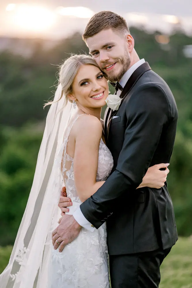 Sunshine Coast wedding photographers couple embracing during romantic maleny manor wedding
