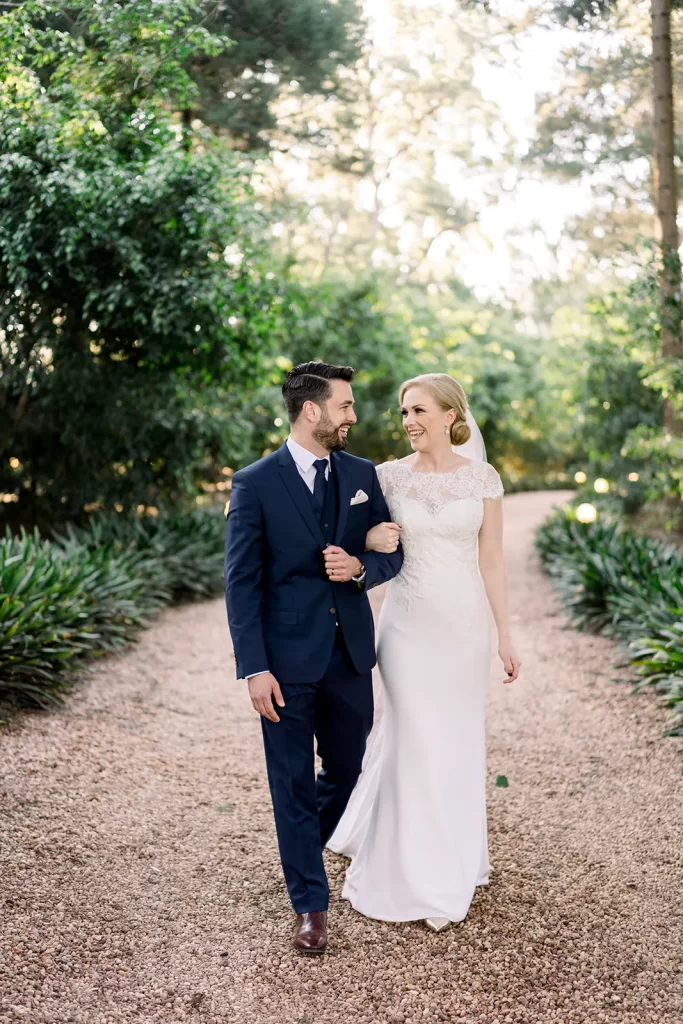 wedding couple (bride and groom) walking down the driveway at gabbinbar homestead