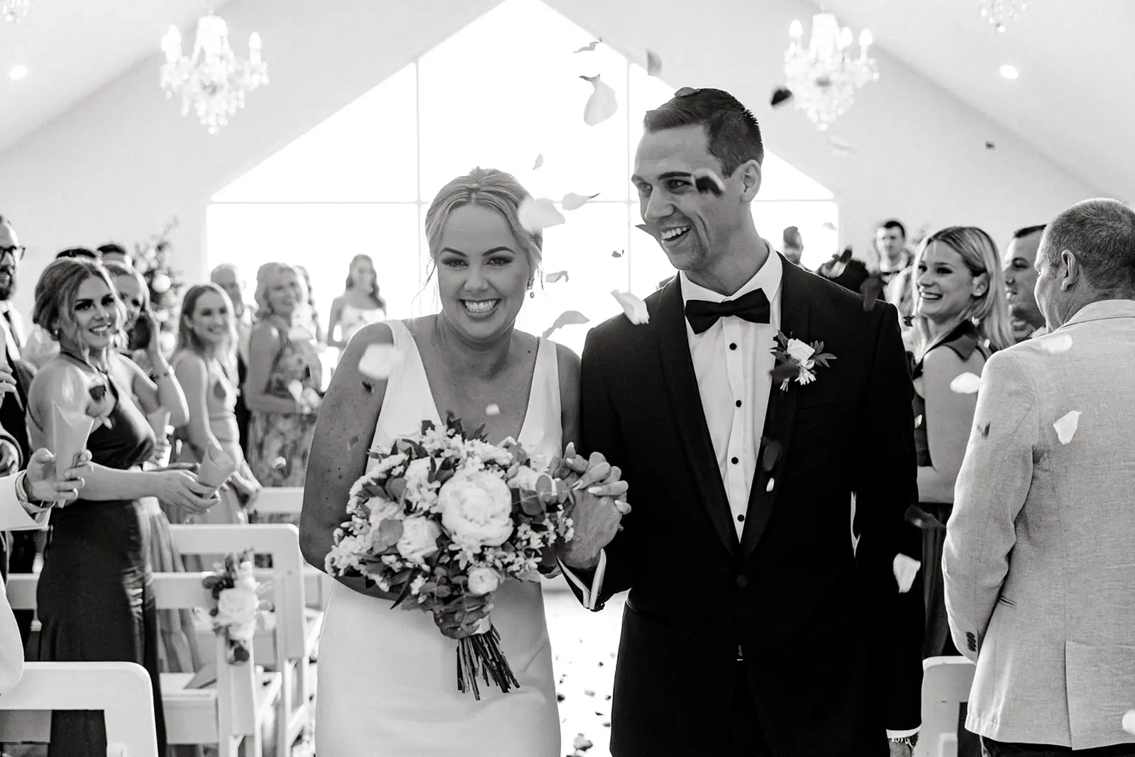 weddings at tiffanys bride and groom exit flower petals