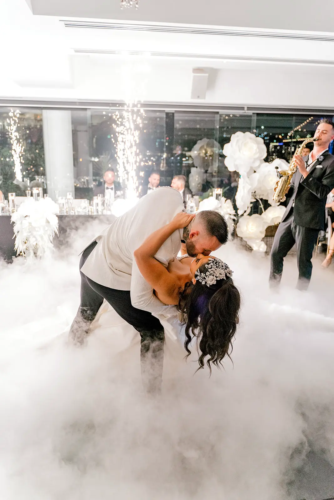 Brisbane wedding photographer bride and groom during the first dance sparklers and smoke