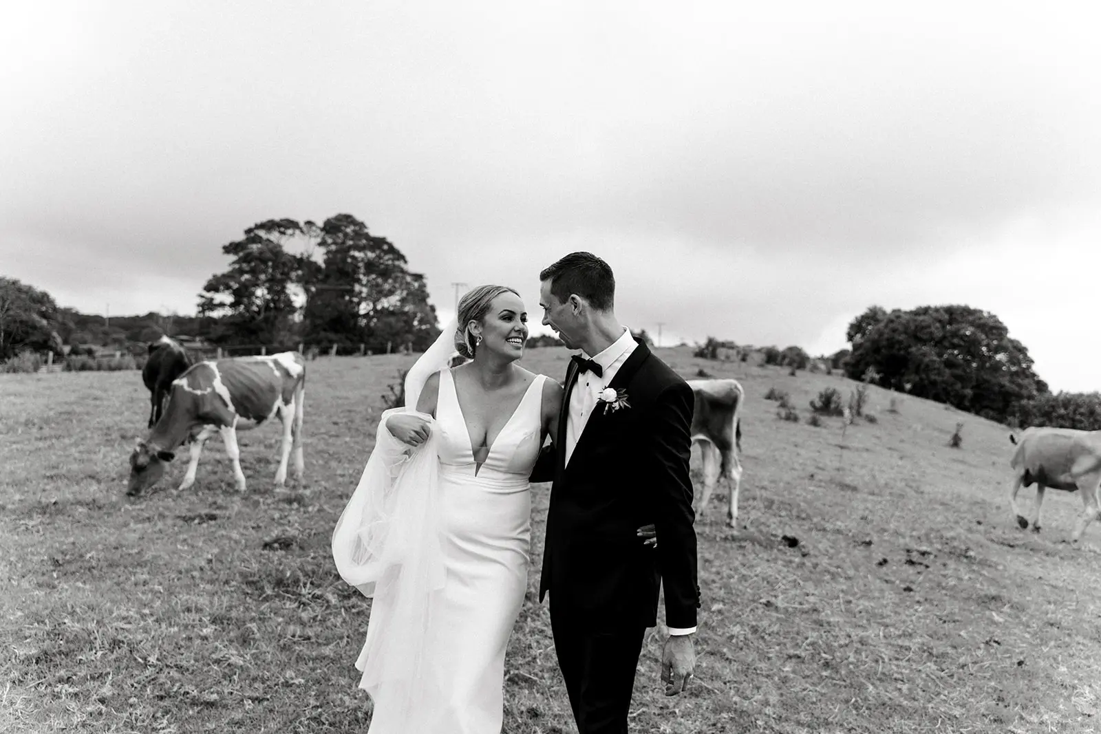 Bride and groom share first kiss at Maleny Manor captured by Ben & Hope, relaxed sunshine Coast wedding photographers